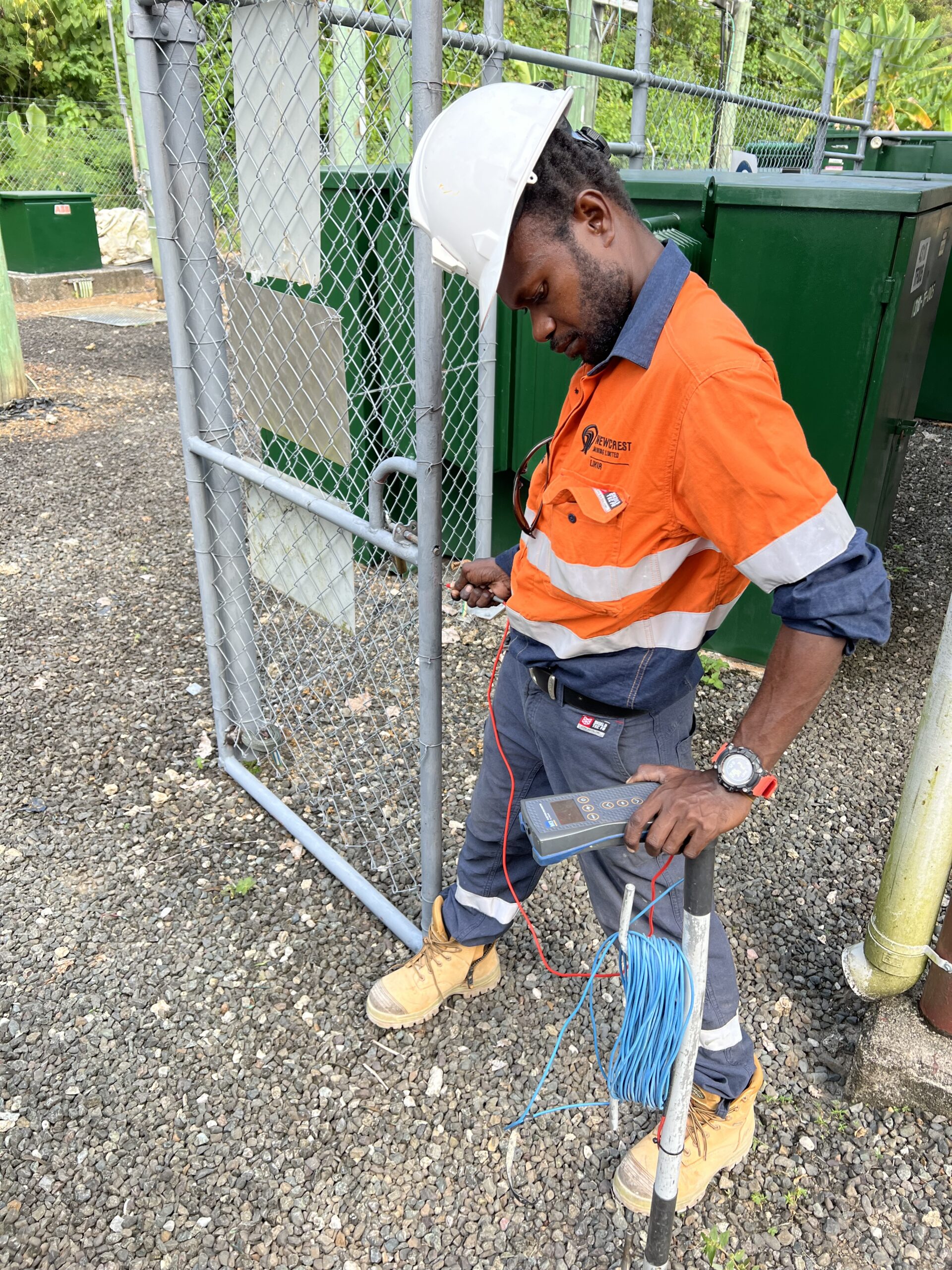 Newcrest Mining electrical staff helping Safearth members with earthing testing - PNG
