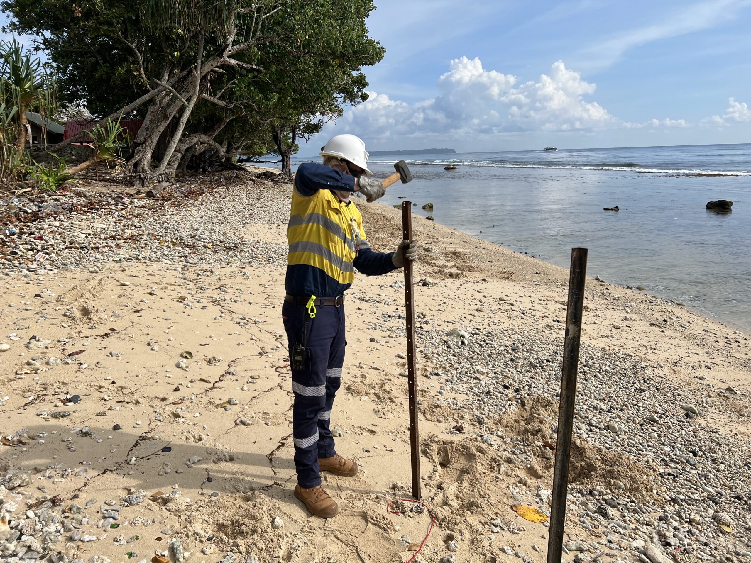 Riley setting up testing equipment on Lihir Island, PNG