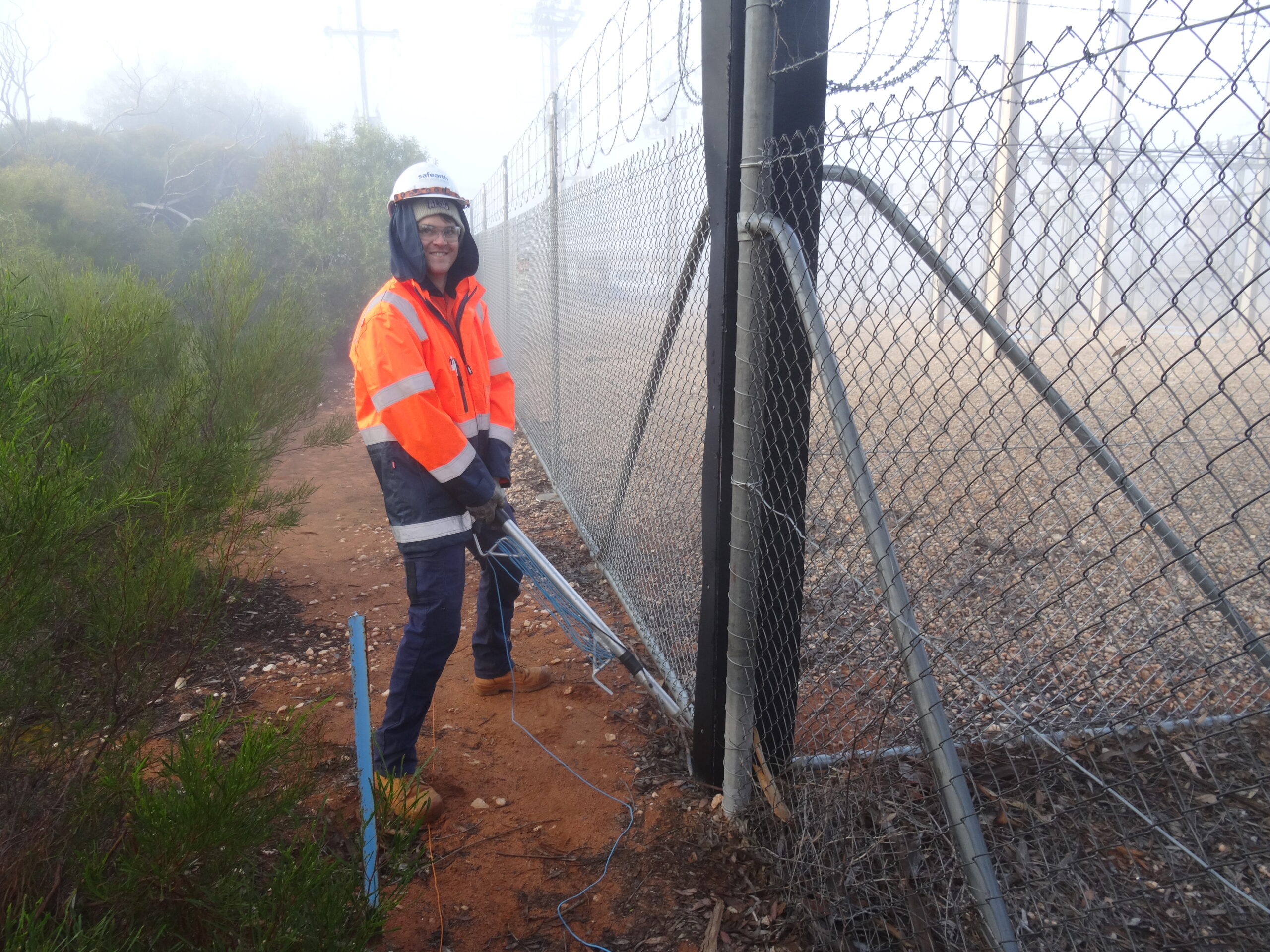 Riley performing a voltage measurement with the Safearth Pogo Stick in Paringa, South Australia